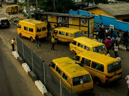 yellow vans on side of road