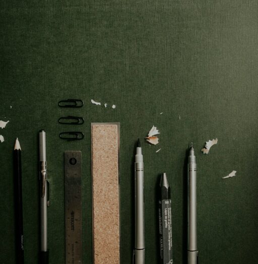 black and white pen beside brown ruler